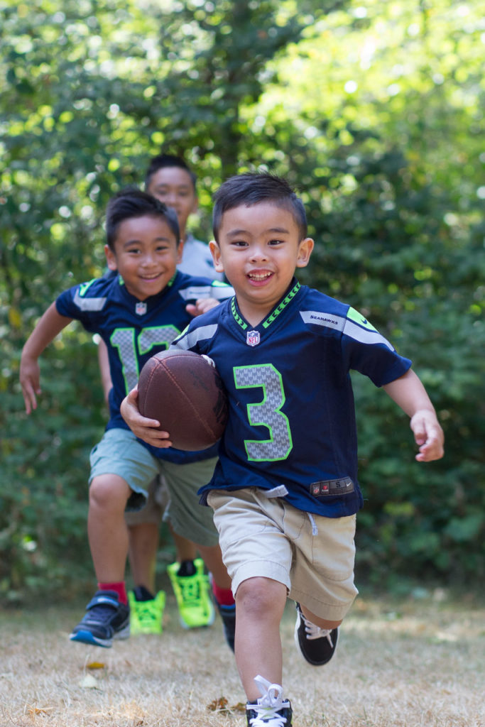 brothers playing football